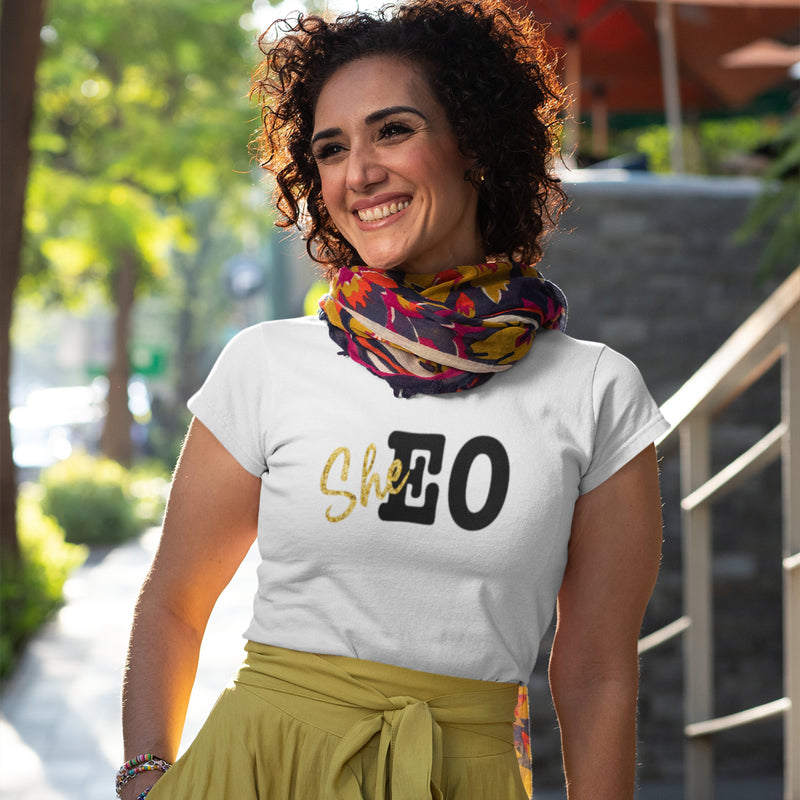Woman wearing a white SheEO t-shirt